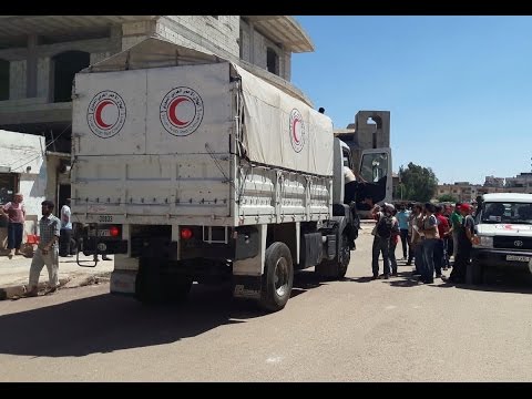 أول قافلة مساعدات منذ حزيران تدخل حيًّا محاصرًا في حمص السورية